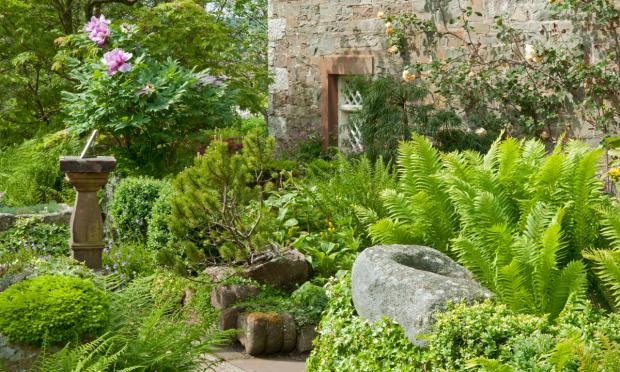 Scottish Gardener: Sundials and stone troughs are scattered around the garden.