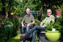 David and Tom sit, for once, and enjoy the garden they have created together.